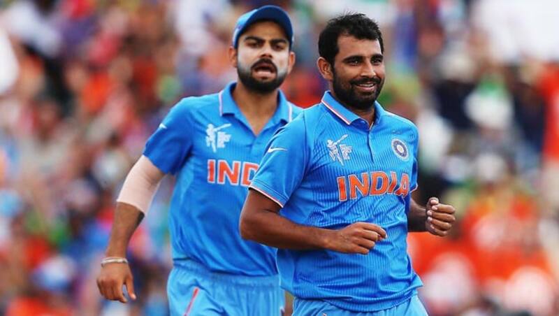 Chamu Chibhabha, was dismissed for mere seven by Mohammed Shami (right) after being caught by Shikhar Dhawan © Getty Images