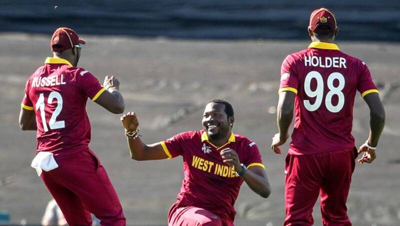 Ravindra Jadeja was dismissed for mere 13 by Andre Russell (middle) after being caught by Marlon Samuels &copy; Getty Images