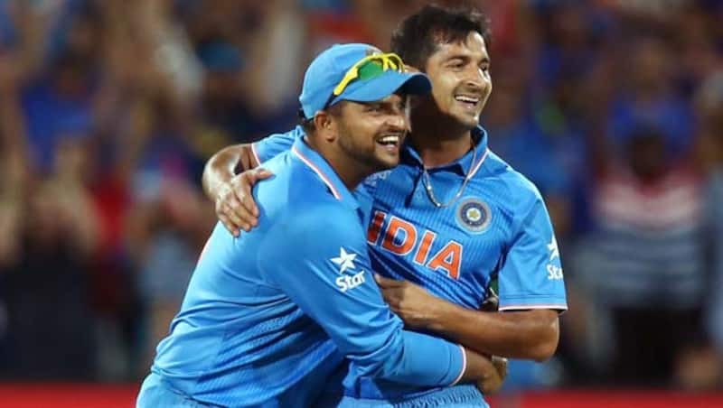 Jason Holder survived a run out scare off Suresh Raina (left) © Getty Images