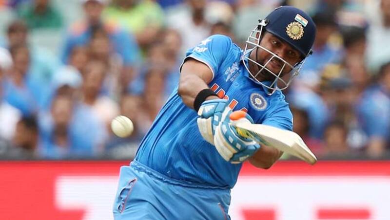 Suresh Raina (above) was dismissed for 22 by Dwayne Smith after being caught behind by Denesh Ramdin © Getty Images