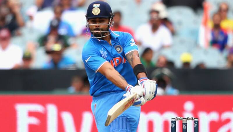 Virat Kohli (above) contributed 27 and Ajinkya Rahane contributed 19 with four extras in the stand © Getty Images