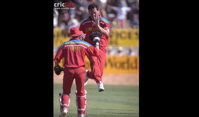 Eddo Brandes celebrates a wicket with Andy Flower