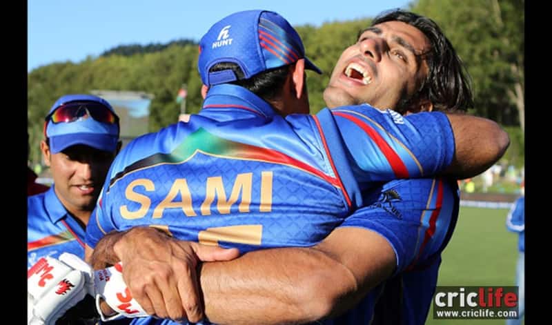 Samiullah Shenwari congratulates Shapoor Zadran after their thrilling win against Scotland