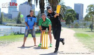 Formula One racer Sergio Perez plays cricket with Brad Hodge and John Hastings