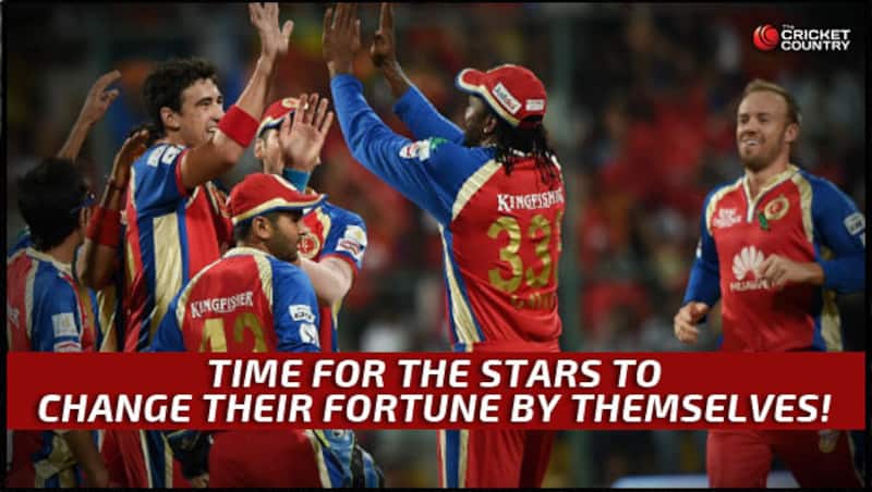 Mitchell Starc, Chris Gayle, AB de Villiers celebrate a wicket with the team &Acirc;&copy; PTI