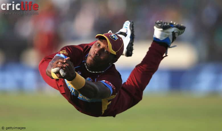 Wisden Photo of the Year: Dwayne Bravo takes a stunning catch to dismiss James Faulkner in ICC World Twenty20 2014