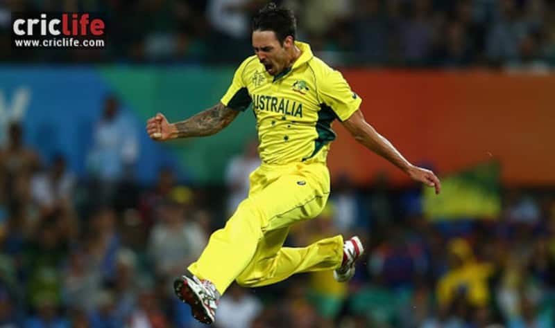 A completely pumped up Mitchell Johnson celebrates the wicket of Rohit Sharma