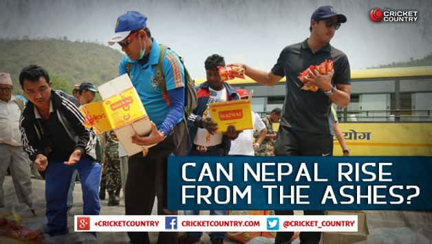 Nepal cricketer Paras Khadka helps out with the distribution of food packets in the aftermath of the earthquakes in the nation. Photo Courtesy: Cricket Association of Nepal.
