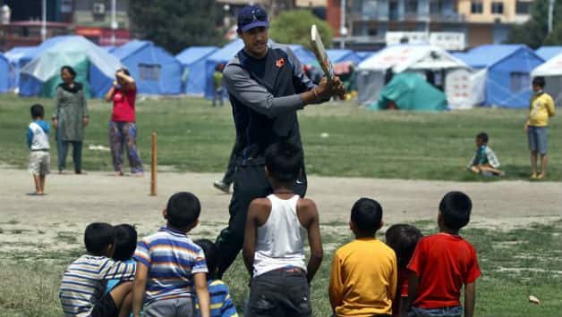 Paras Khadka, the Nepal captain with the quake hit kids. Photo Courtesy: ekantipur.com
