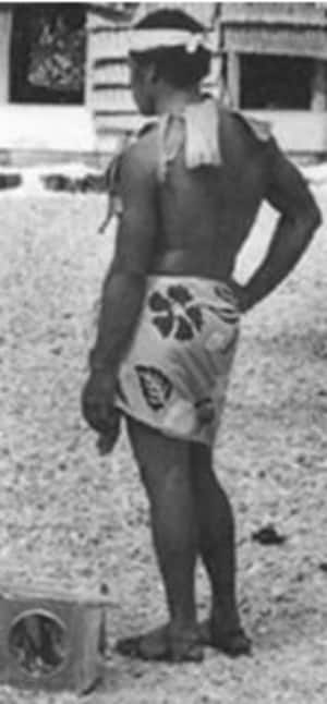 A kilikiti fielder in Tokelau. Apart from being a fielder, this man plays the biscuit tin with drumsticks once a batsman is dismissed. Photo Courtesy: Judith Huntsman