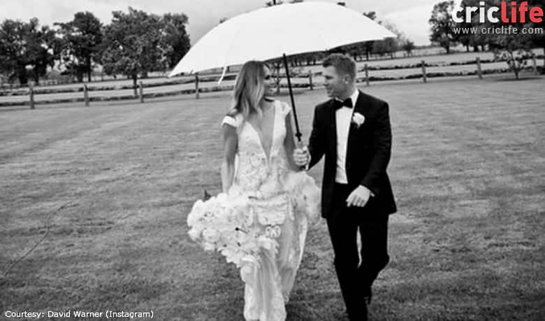 David Warner walks beside Candice Falzon after being pronounced husband and wife