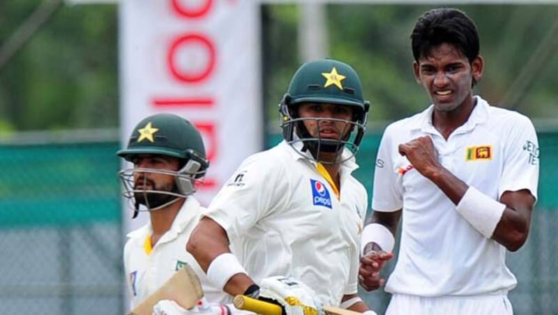 Ahmed Shehzad (left) and Azhar Ali (centre) put on 120 runs for the second wicket © AFP