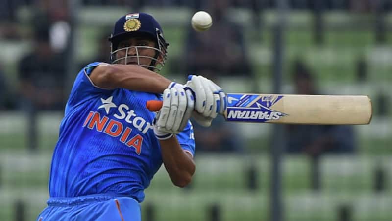 Shahid Afridi could empathise more with MS Dhoni (above) as he has also faced criticism over the years in Pakistan &Acirc;&copy; AFP