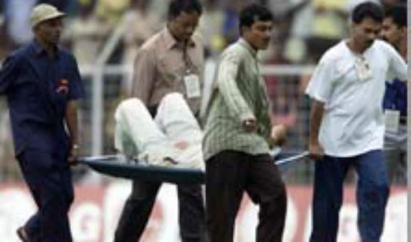 Sourav Ganguly is carried away on a stretcher after he collided with teammate Anil Kumble while trying to take a catch during the fourth day's play of the second Test between India and the West Indies on October 20, 2002