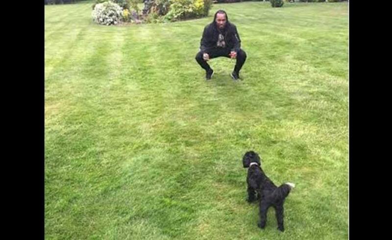 Chris Gayle and his pet Coco having a conversation over a glass of champagne.