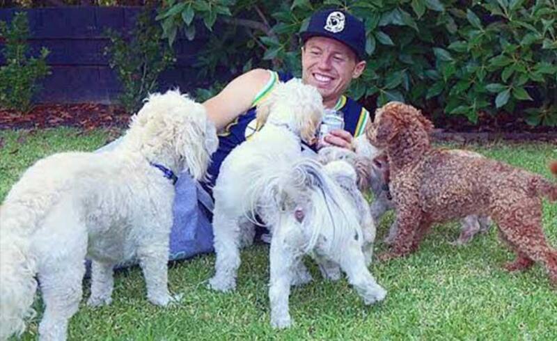Peter Siddle with his dogs Oscar, Axel Ralphie.