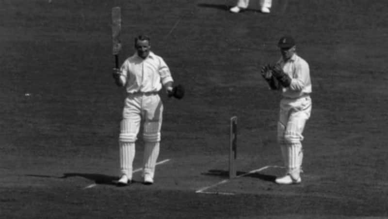 Bradman celebrates a milestone. Duckworth is next to him. Alas, we will never get to know if the run out was fair &copy; Getty Images