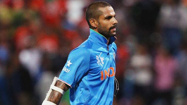 Shikhar-Dhawan-of-India-walks-off-after-being-dismissed-by-Stuart-Thompson-of-Ireland.jpg