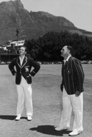 George Mann (left) and Dudley Nourse toss at Newlands. Do note the picturesque backdrop © Getty Images