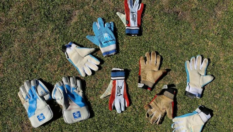 Wicket-keeper-gloves-and-inners-dry-out-on-the-grass-during-day-three-of-the-Future