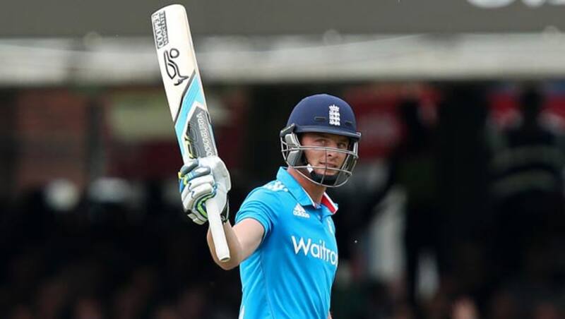 Jos Buttler lifts his bat after completing his century &copy; Getty Images