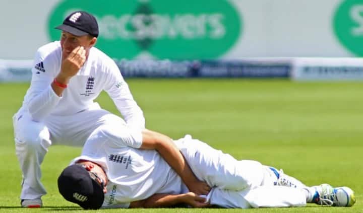 Joe Root reacts as captain Alastair Cook of England lays on the floor after being hit by the ball during day two of the 1st Investec Ashes Test match between England and Australia at SWALEC Stadium on July 9, 2015 in Cardiff (Image Courtesy: Getty Images)