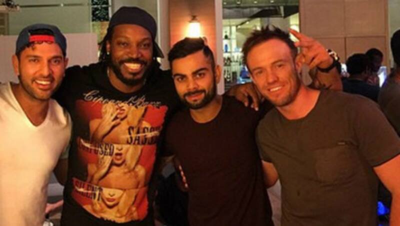 Chris Gayle (middle) seen with Yuvraj Singh(right), Virat Kohli and AB de Villiers (left) Photo Courtesy - Chris Gayle Instagram  