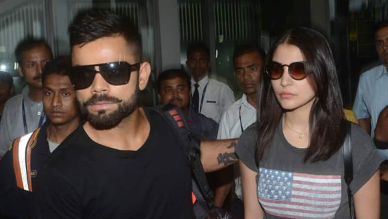 Virat Kohli (left) is not yet done and over with Anushka Sharma, and is in a desperate attempt to win the heart back of her lady love © IANS