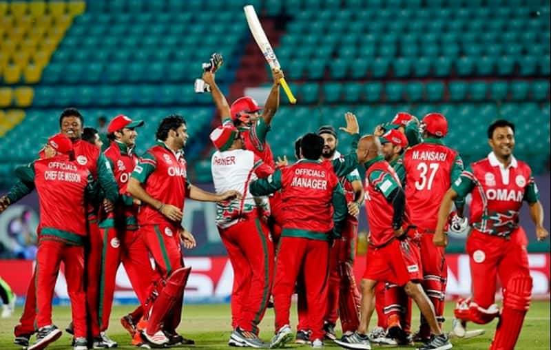 Oman celebrate their historic win over Ireland on Wednesday night. Photo courtesy: PA Images & @RyanK_Bailey on Twitter