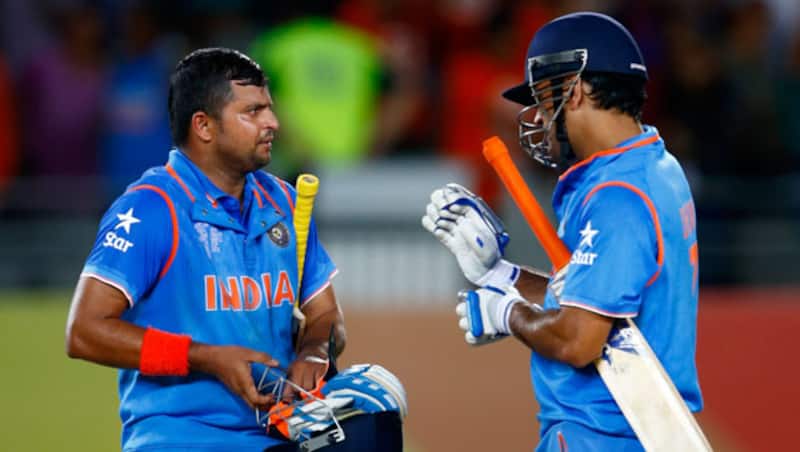 सुरेश रैना और महेंद्र सिंह धोनी  © Getty Images
