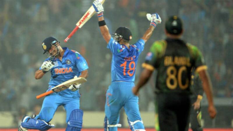 Suresh Raina (left) and Virat Kohli celebrate after winning the ICC World T20 match against Pakistan at Dhaka (Photo courtesy: Getty Images)