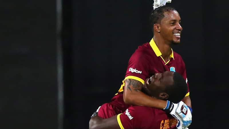 Carlos Brathwaite (right) was given the Team India jersey by Virat Kohli &Acirc;&copy; Getty Images
