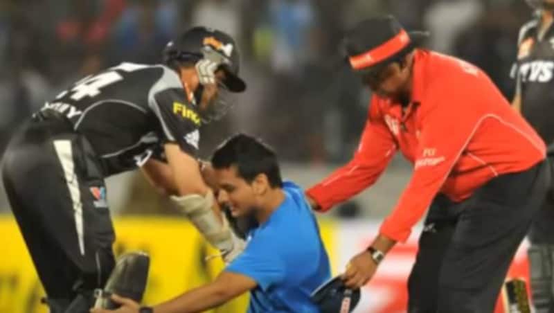 An emotional fan tries to touch Sourav Ganguly's feet during IPL 2011 match. Picture courtesy: Youtube (shahzadnandla)