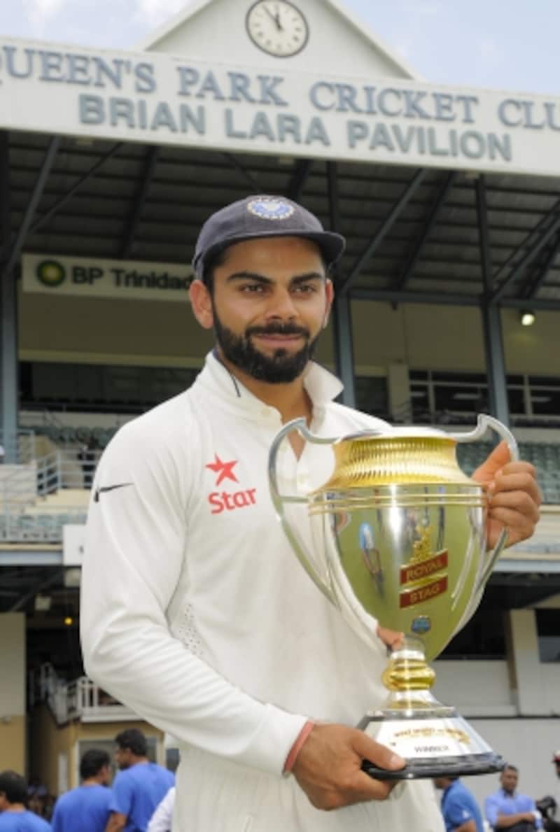 Virat Kohli poses with the trophy after India's series win in West Indies &copy; AFP