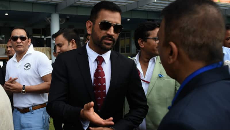 MS Dhoni sporting a new look arrives at Green Park, much to the fans' delight © AFP