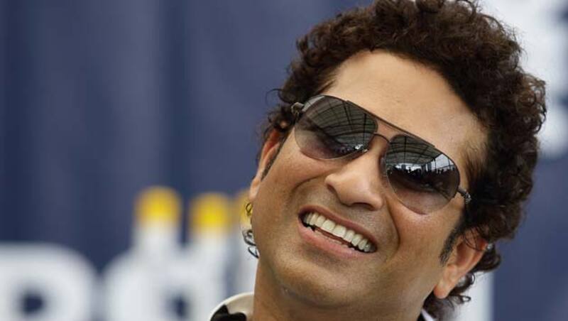 Sachin Tendulkar along with Chris Martin met school students &copy; Getty Images 