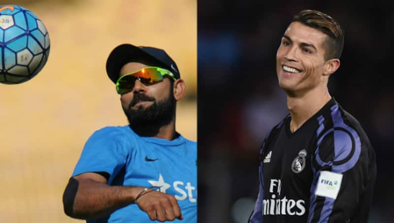 Virat Kohli feels Cristiano Ronaldo can give Lionel Messi run for money &copy; AFP and Getty Images