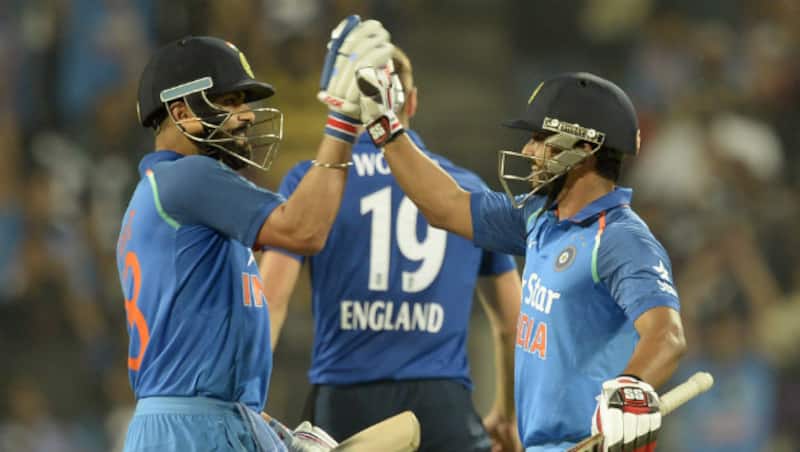 Virat Kohli (left) and Kedar Jadhav added a 200-run stand for the fifth wicket &Acirc;&copy; AFP