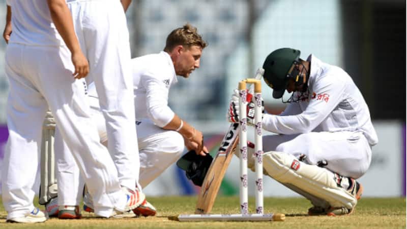 Joe Root (left) consoles Sabbir Rahman after winning the first Test between Bangladesh and England at Chittagong. (Courtesy: Getty Images)