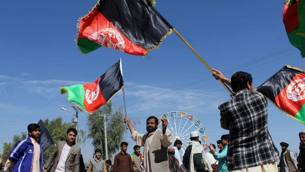 Afghan cricket fans celebrate their national cricket team victory in the World Cup 2015 © AFP