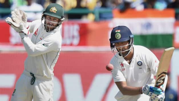 Cheteshwar Pujara continued to bat unperturbed with all that happened in the middle to score a fine unbeaten half-century © PTI