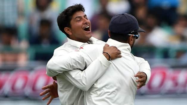 Kuldeep Yadav celebrates one of his many wickets on Day One at Dharamsala © AFP