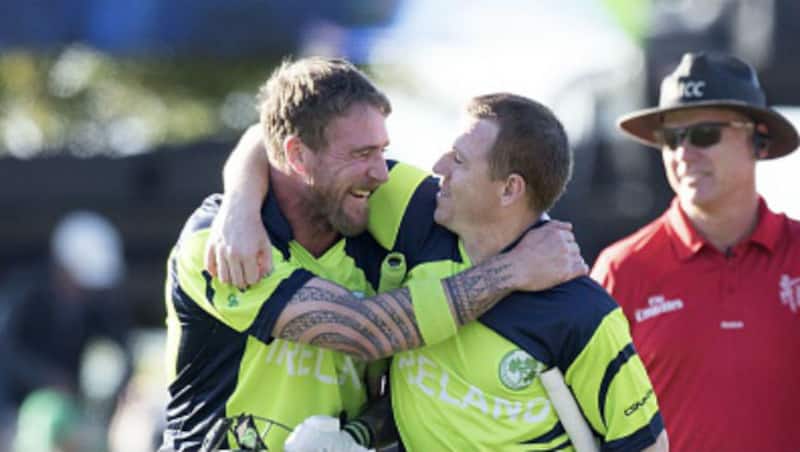 Niall O'Brien celebrates with John Mooney after Ireland's win against West Indies in 2015 World Cup &copy; AFP