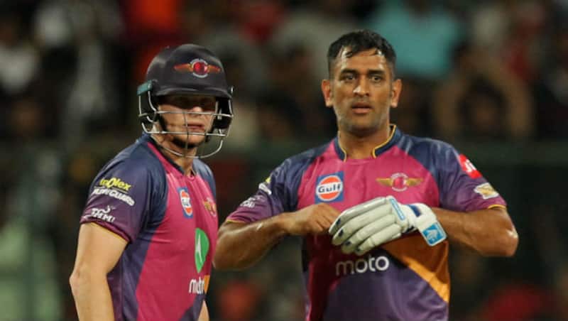 Steven Smith (left) and MS Dhoni in action on Sunday night &Acirc;&copy; BCCI