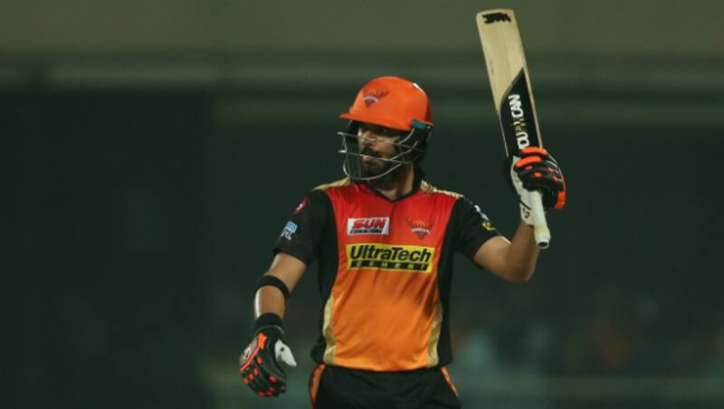 Yuvraj Singh raises his bat after slamming fifty &copy; BCCI