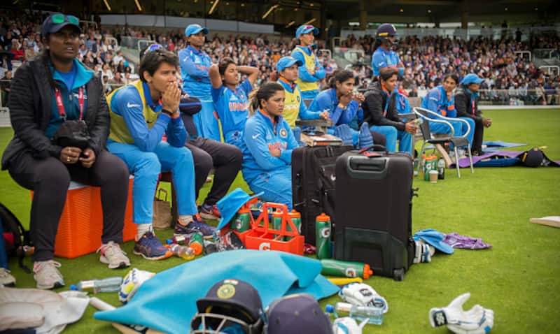 Dejected India Women watch their side collapse against England in the final &Acirc;&copy; Getty Images