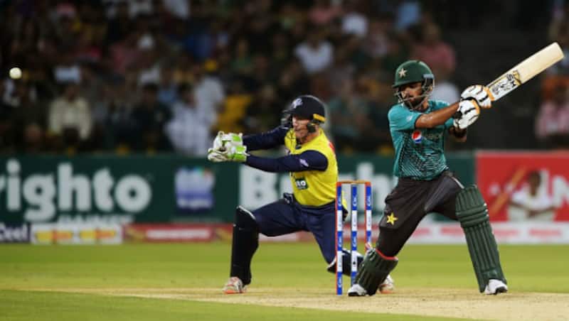 George Bailey keeping wickets as Umar Akmal's cousin Babar Azam strikes another good shot. (Image courtesy: AFP)