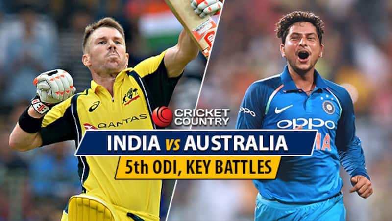 David Warner and Kuldeep Yadav © AFP