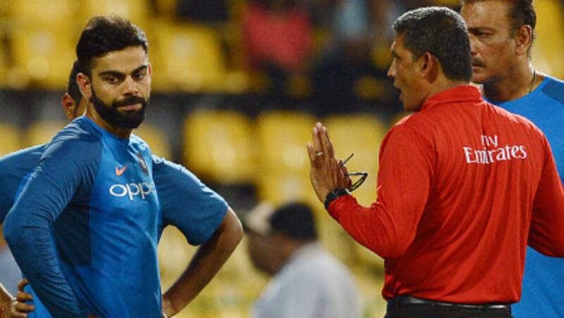 Virat Kohli (left) and umpire Ruchira (Image courtesy: Getty)