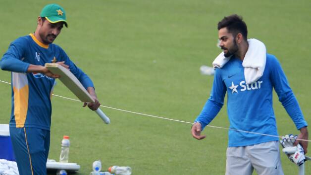Mohammad Aamer and Virat Kohli © AFP